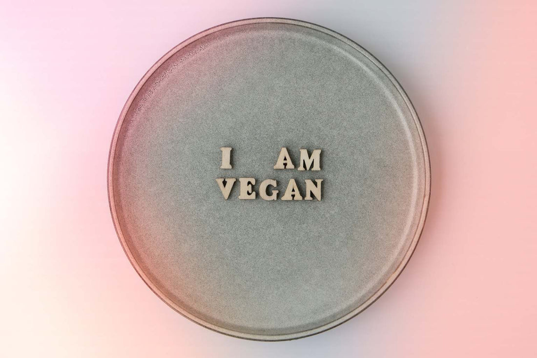 plate with wooden letters saying I am vegan